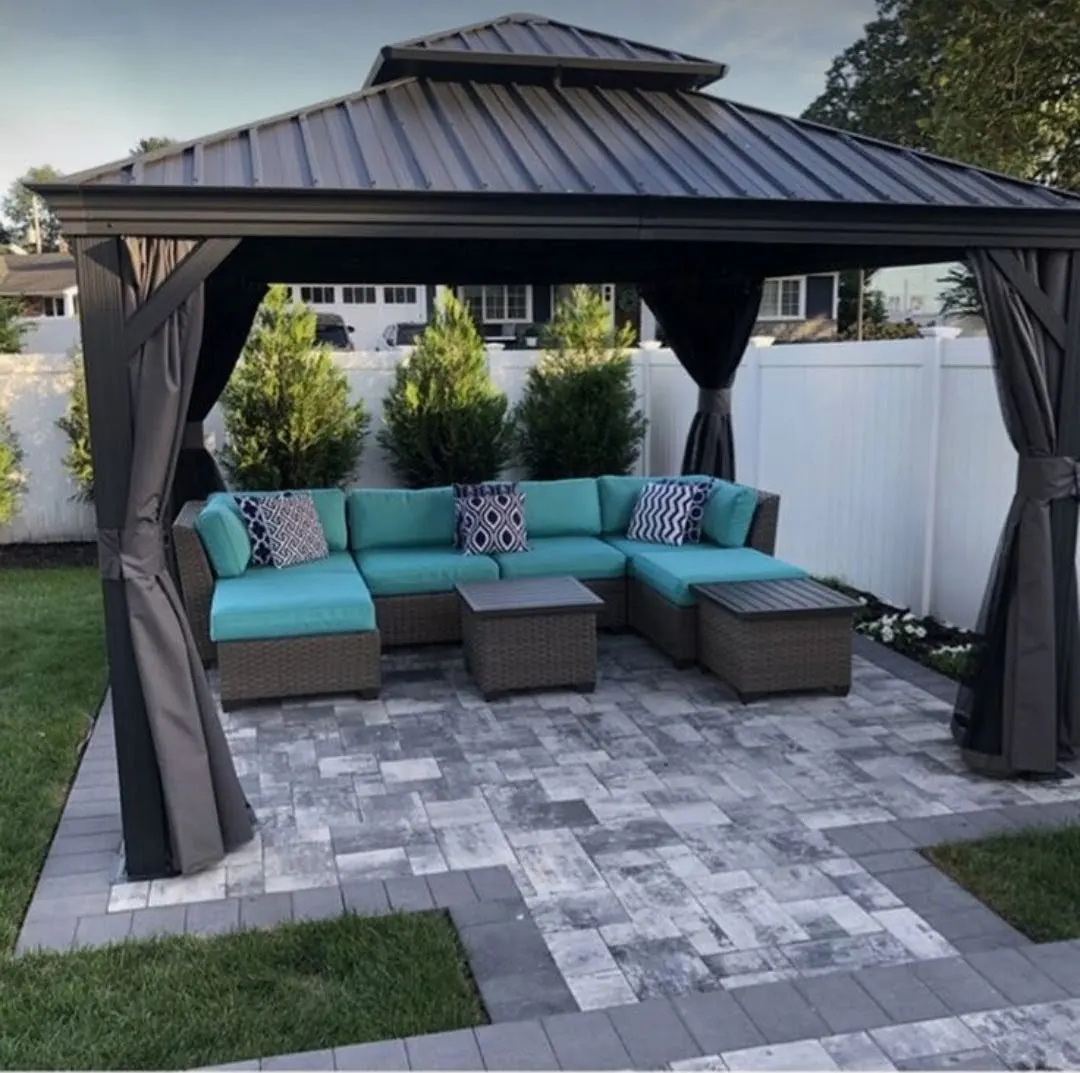 Hardtop gazebo with sectional seating on a custom paver patio