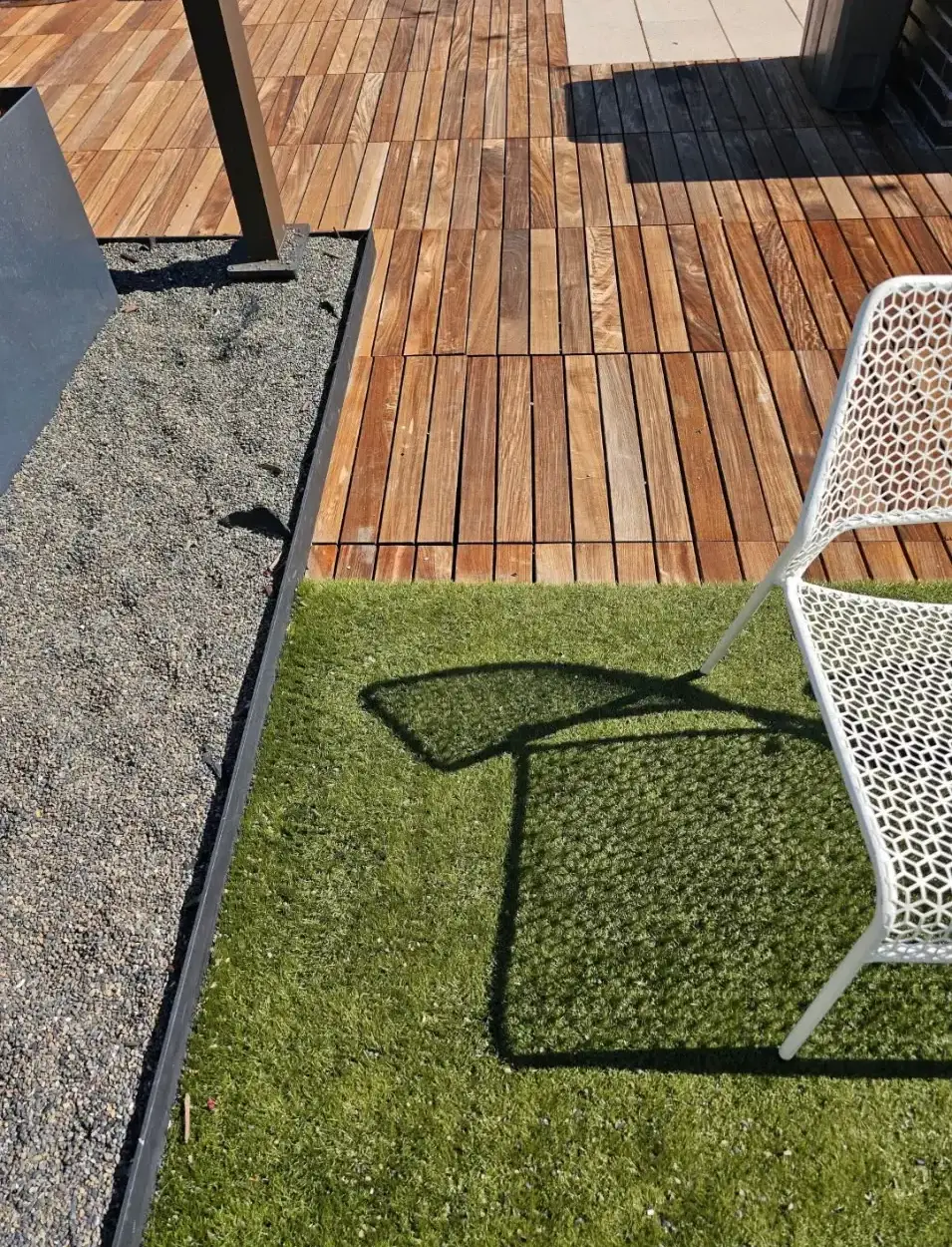 Wood deck with artificial turf rooftop installation