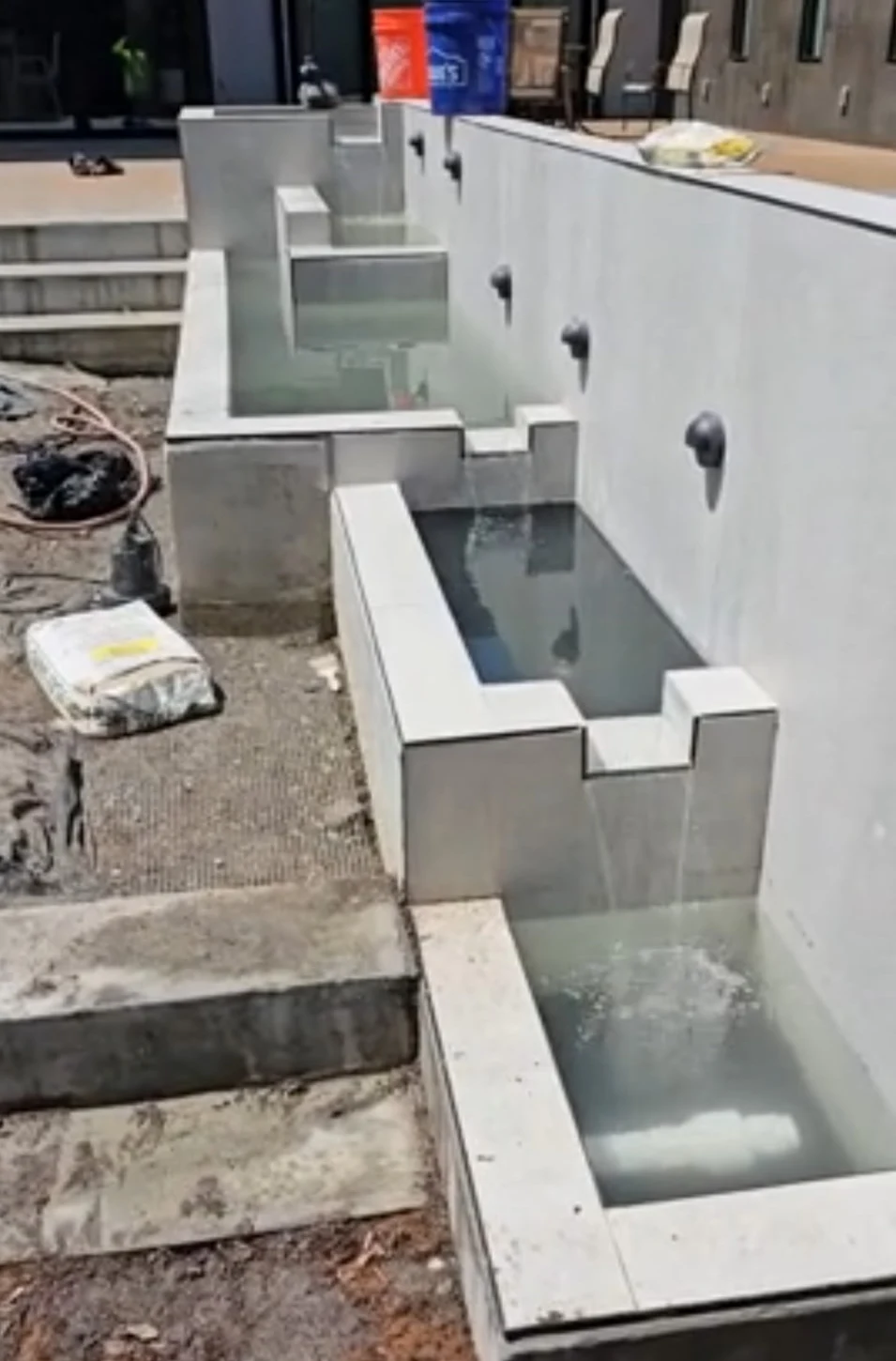 Modern concrete water feature with multi-level basins